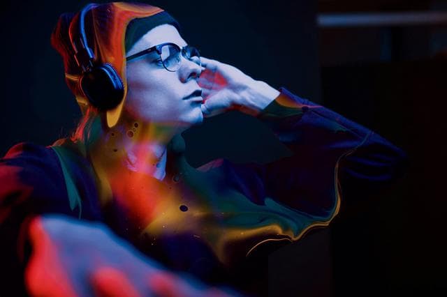 man listening to music on headphones